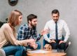 Couple talking to insurance broker
